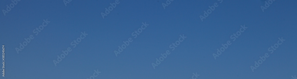 Image of a clear and cloudless sky can be used as background