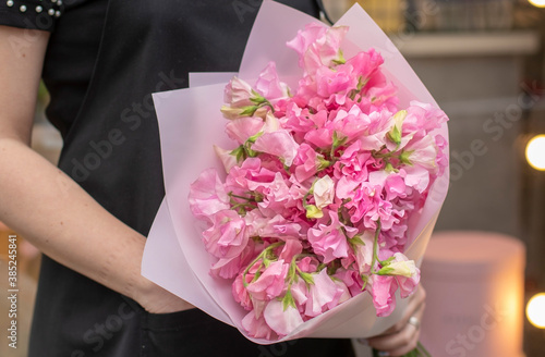 Wallpaper Mural Flower shop. Beautiful bouquet of mixed flowers in woman hand. the work of the florist at a flower shop. Delicate Pastel color. Fresh cut flower. Torontodigital.ca