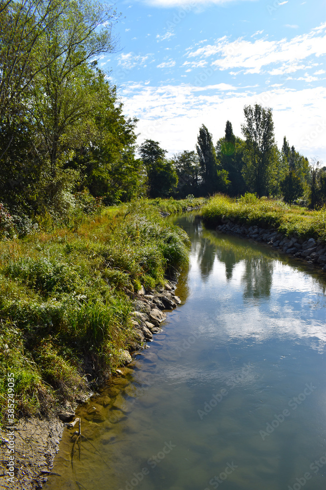 view of a countryside landscape with river and wild nature