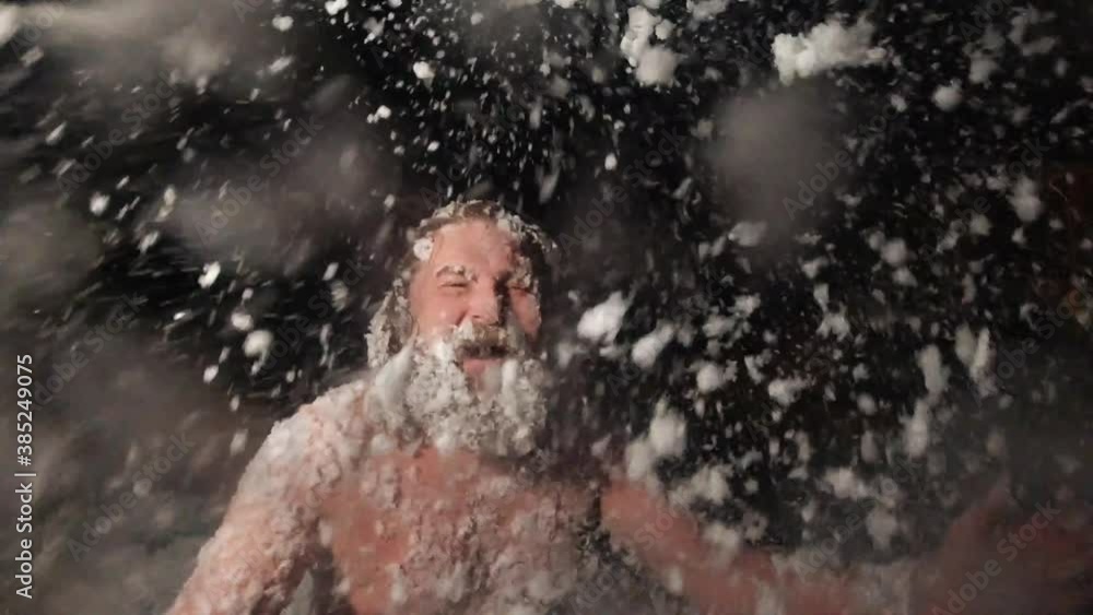 A cheerful naked man covered in snow A cheerful naked man covered in snow