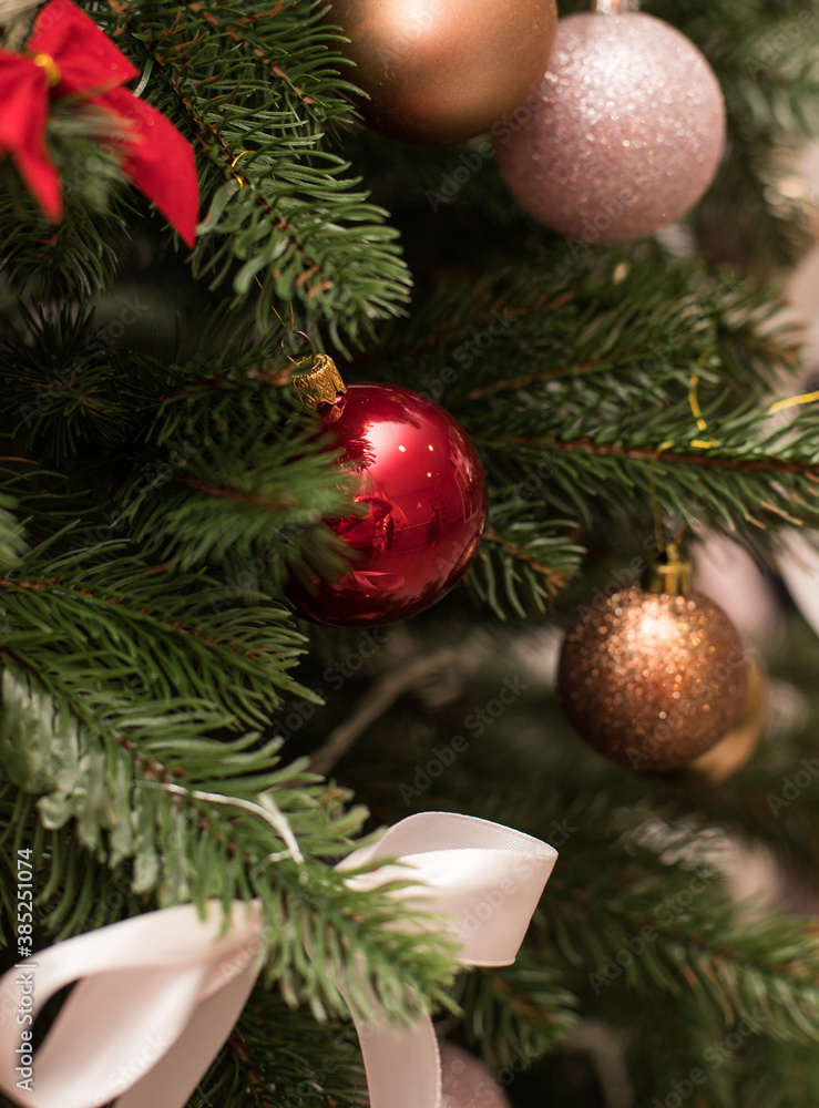 Christmas bouquet. Red flower of carnation, cone and cotton with Christmas tree branches. New year bouquet flowers and fir branches in a basket. Christmas wreath Christmas bouquet. Red flower of carnation, cone and cotton with Christmas tree branches. New year bouquet flowers and fir branches in a basket. Christmas wreath