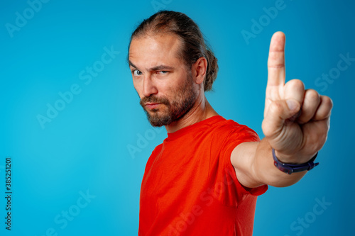 Bearded man gesturing 'stop' or 'wait a minute