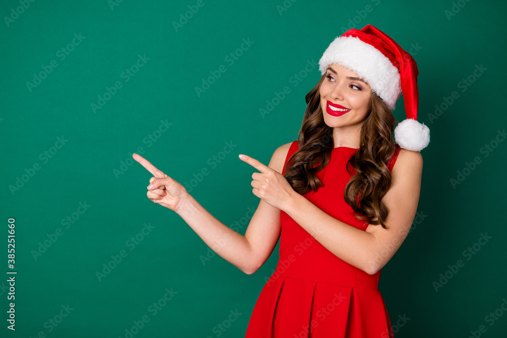Photo lovely sweet pretty girl in santa claus headwear point index finger copyspace indicate x-mas jolly holly magic miracle christmas adverts wear skirt isolated green color background Photo lovely sweet pretty girl in santa claus headwear point index finger copyspace indicate x-mas jolly holly magic miracle christmas adverts wear skirt isolated green color background
