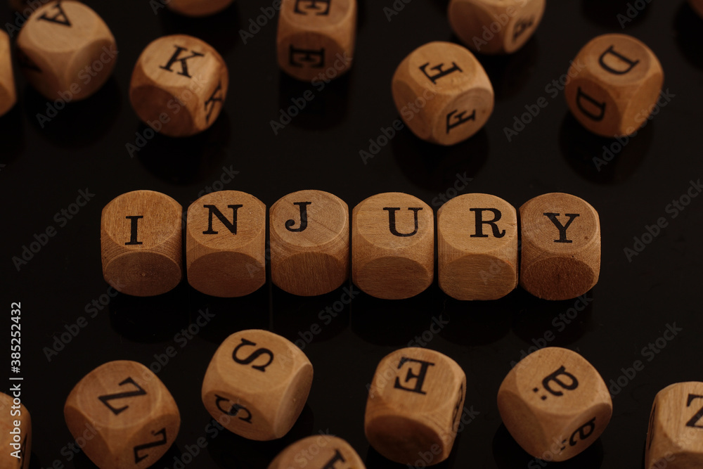 Wooden blocks with the word Injury Wooden blocks with the word Injury