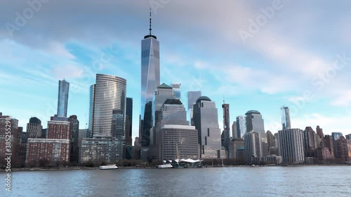 Downtown Manhattan skyline from the ferry tour at winter sunset, New York City. Slow motion