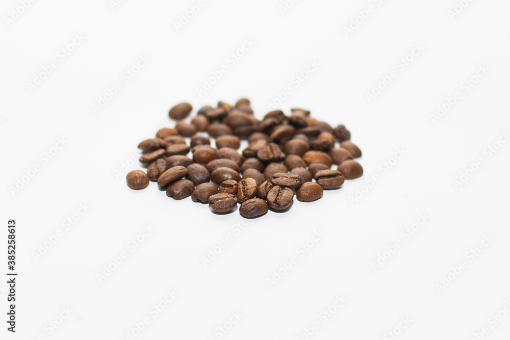 roasted coffee beans on a white background. fresh coffee. isolate roasted coffee beans on a white background. fresh coffee. isolate
