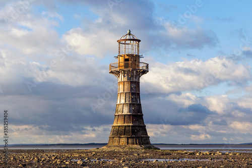 Fotobehang Whiteford Lighthouse is listed by Cadw as Grade II* A wave-swept cast-iron lighthouse in British coastal waters and an important work of cast-iron engineering and nineteenth-century architecture