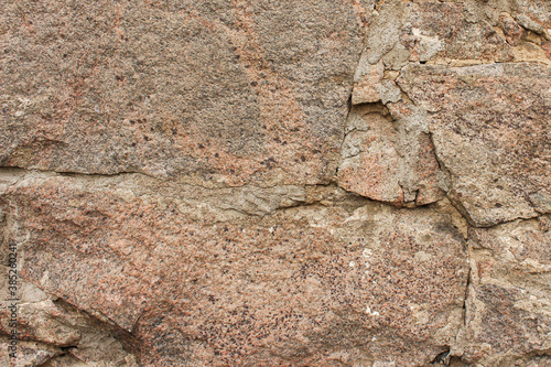 Old stone wall in daylight.