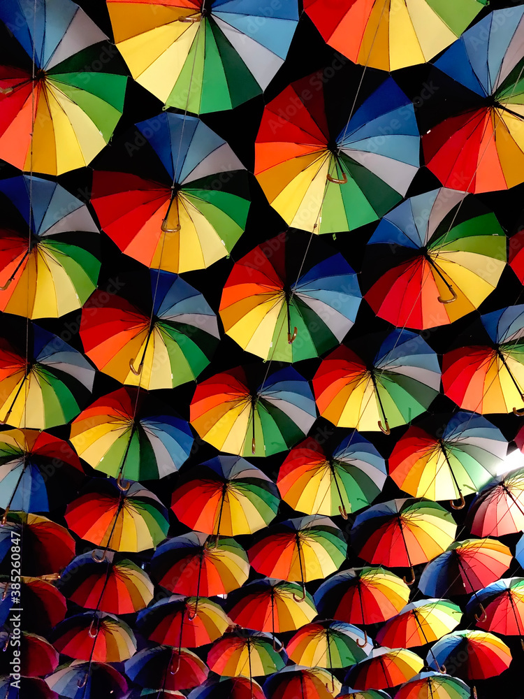 Background from many multi-colored umbrellas.