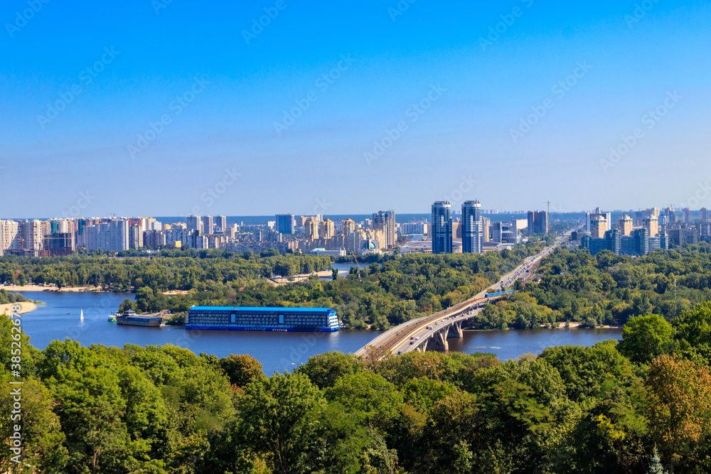 Fototapeta premium Aerial view of Metro bridge and the Dnieper river in Kiev, Ukraine. Kyiv cityscape