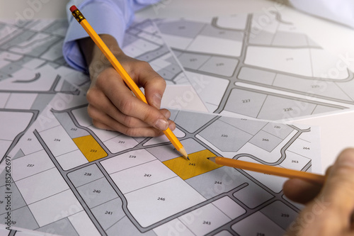 people discussing about territory building plots for sale on cadastral map