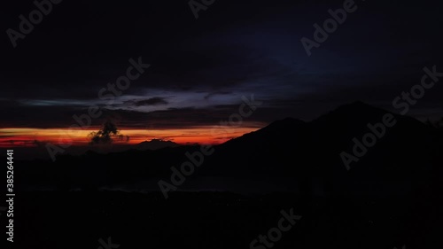 Wallpaper Mural 4K Time lapse of dawn on Batur Mount viewpoint. View on mountains and village on lake. Sunrise night to day. Early morning. Torontodigital.ca