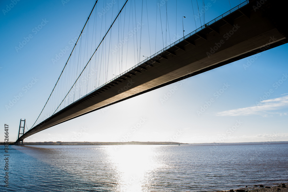 A large suspension bridge in bright blue skies and sunlight A large suspension bridge in bright blue skies and sunlight