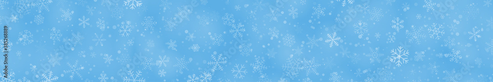 Christmas banner of snowflakes of different shapes, sizes and transparency on light blue background Christmas banner of snowflakes of different shapes, sizes and transparency on light blue background