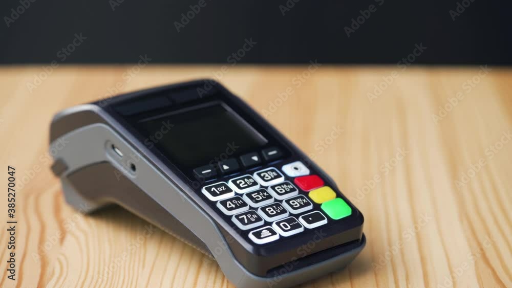Contactless payment with smartphone with green mock-up screen. Wireless payment concept. Close-up, woman using smartphone cashless wallet NFC technology to pay order on bank terminal. Contactless payment with smartphone with green mock-up screen. Wireless payment concept. Close-up, woman using smartphone cashless wallet NFC technology to pay order on bank terminal.