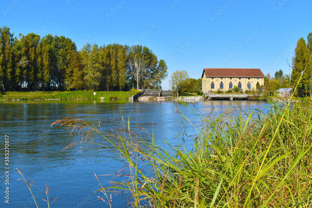 Obraz premium view of a countryside landscape with river and wild nature