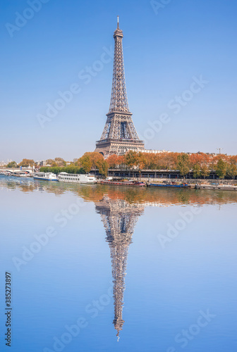 Eiffel Tower with autumn leaves in Paris, France