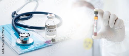 Healthcare and medical background concept. COVID 19 vaccine or Coronavirus vaccine with needle  prepare for injection