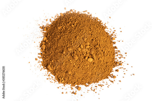 Heap of cacao powder isolated on white background. Dark Cacao powder isolated over white background. Top view. Pile of cocoa powder isolated