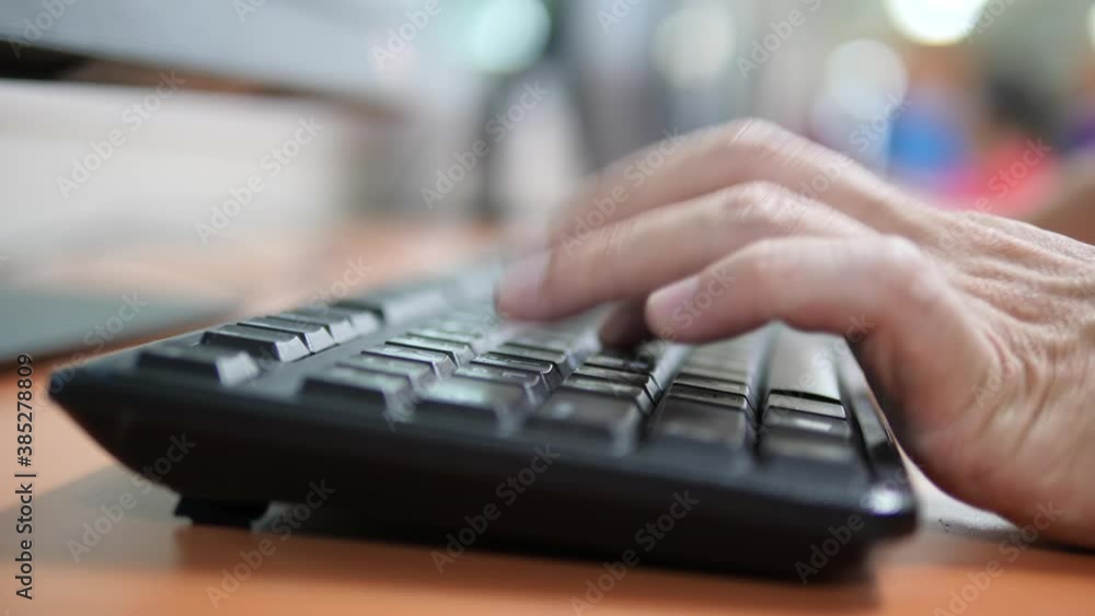 close up of pressing black keyboard buttons
close up of pressing black keyboard buttons