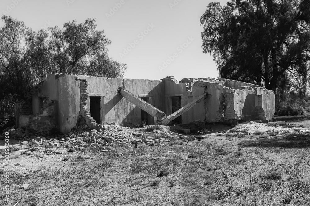 old destroyed mud brick house (black and white photo) old destroyed mud brick house (black and white photo)