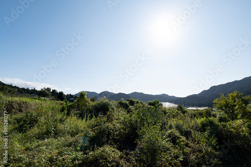A view of an agricultural village deep in the mountains of Japan  taken on a clear day