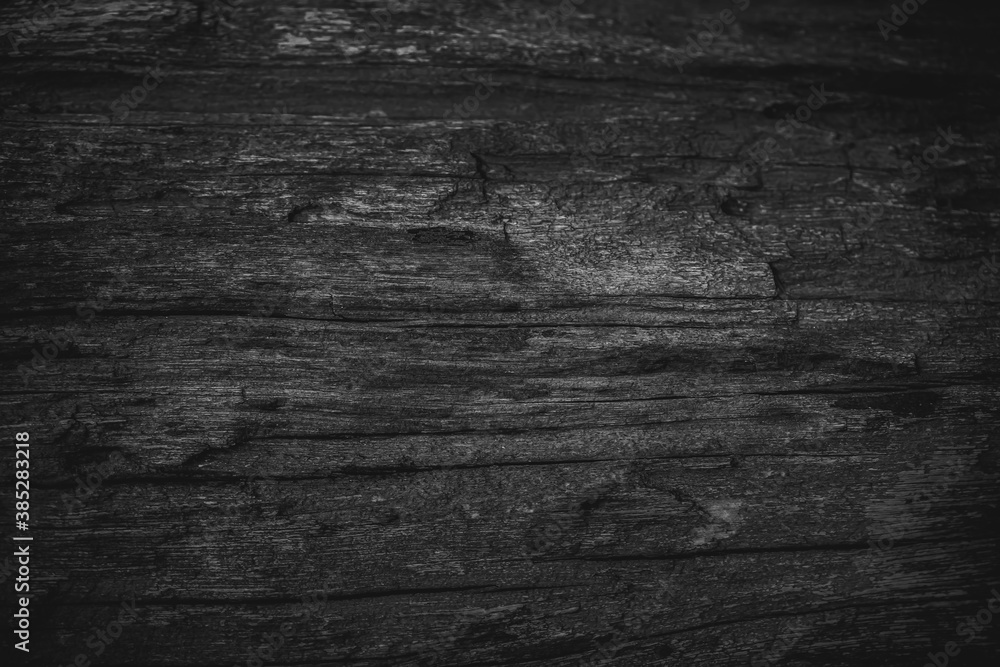Naklejka premium Vintage background image of the old gray wooden has a rough texture and different grain patterns. There are straight and curved lines. There are vignettes and the middle of the image for copy space.