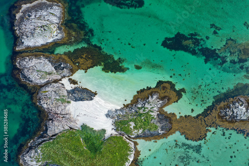 Aerial view of beach, islands and turquoise ocean in Lofoten Norway