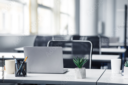 Empty space workplace in coworking office during quarantine covid-19 photo