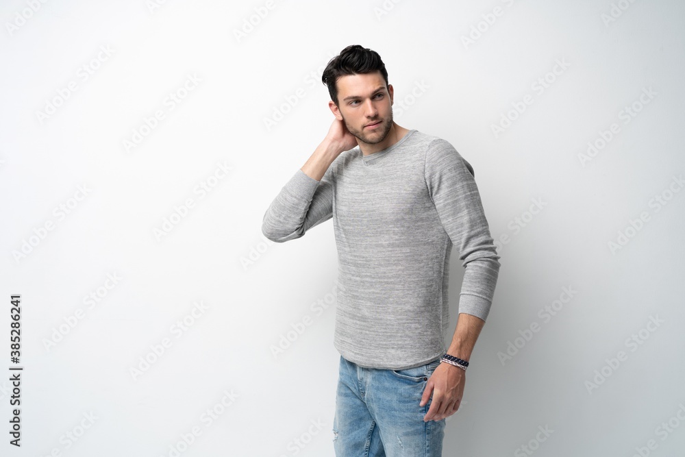 Handsome young man on white background looking at camera. Happy guy smiling. Handsome young man on white background looking at camera. Happy guy smiling.