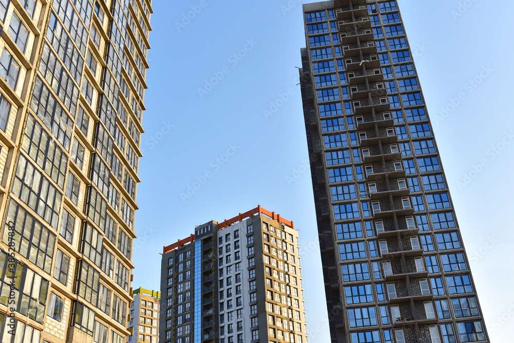 Obraz premium Construction of skeleton of modern residential buildings. Erection multi-storey building. Mineral wool insulation facade. Thermal protection of house. Preparing to pour of concrete into formwork