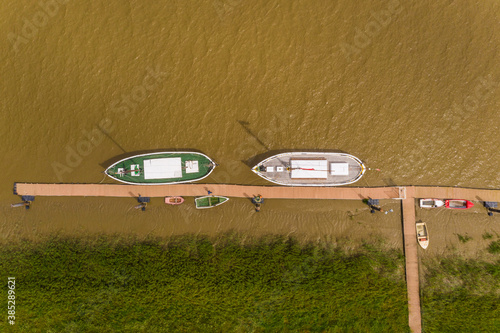 Aerial view of boats moored on the Sado river at Alcácer do Sal, Portugal.