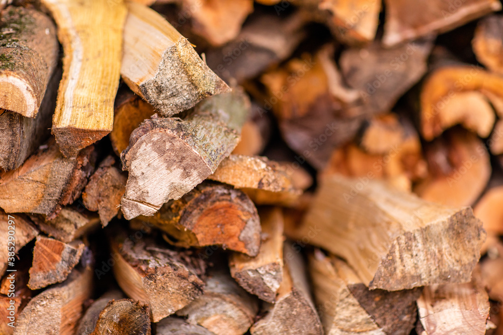 Christmas texture background of dry wooden log cabins. Woodpile of cut Lumber for forestry industry Christmas texture background of dry wooden log cabins. Woodpile of cut Lumber for forestry industry
