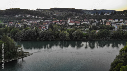 Old dam of water power plant with tributary of river Aare in riparian forest in Brugg, Switzerland.