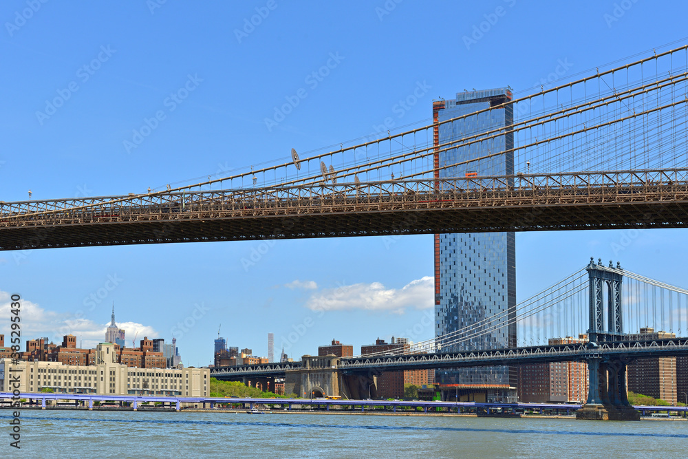 Brooklyn Bridge and Manhattan Bridge, suspension bridges that crosses East River in New York City, United States