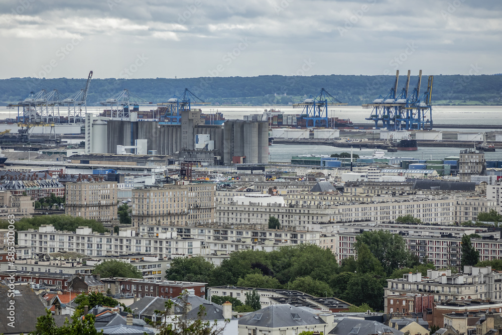 Panoramic view of Le Havre from Hanging gardens (Jardins Suspendus). Port of Le Havre with portal cranes and containers on the background. Le Havre, France.