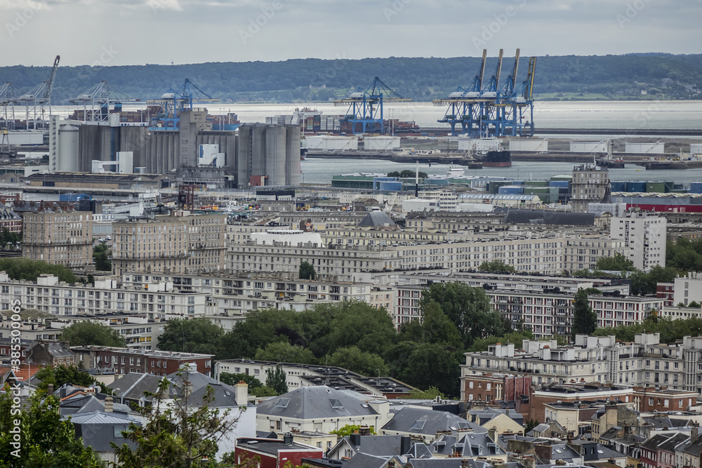 Panoramic view of Le Havre from Hanging gardens (Jardins Suspendus). Port of Le Havre with portal cranes and containers on the background. Le Havre, France.