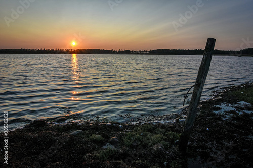 Beautiful sunset over Swedish sea shore © Piotr Wawrzyniuk