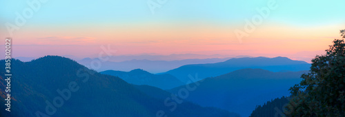 Beautiful landscape with cascade blue mountains at the morning - View of wilderness mountains during foggy weather