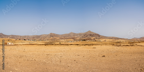 Panoramic view of a desert landscape somewhere in the central part of the Fuerteventura. Canary Islands. Spain.