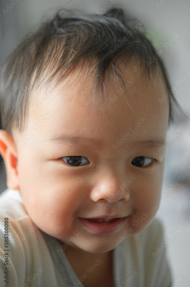 11 months baby boy portrait, asian kid face, little boy smiling 11 months baby boy portrait, asian kid face, little boy smiling
