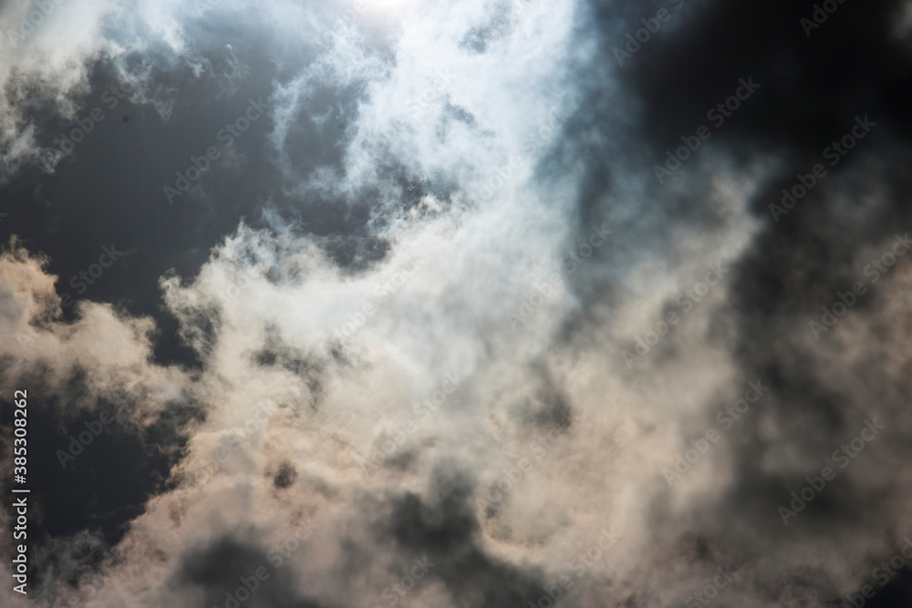 Dark and Dramatic Storm Clouds with sunlight in the background Dark and Dramatic Storm Clouds with sunlight in the background