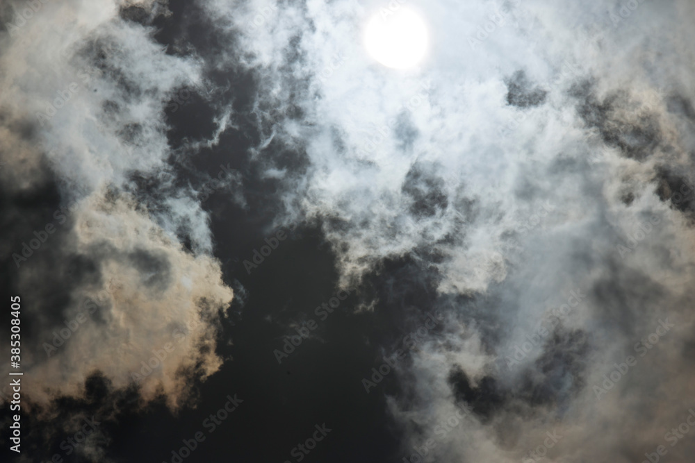Dark and Dramatic Storm Clouds with sunlight in the background Dark and Dramatic Storm Clouds with sunlight in the background