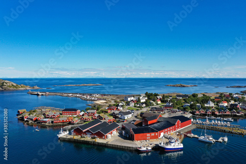 Drone view of red fishing cabins, islands and ocean in Lofoten, Norway