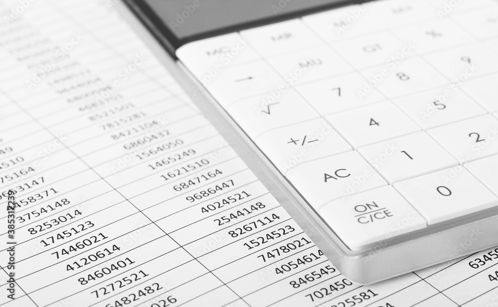 Calculator with Financial accounting graphs. Finance, business and accounting concept. Calculator with Financial accounting graphs. Finance, business and accounting concept.