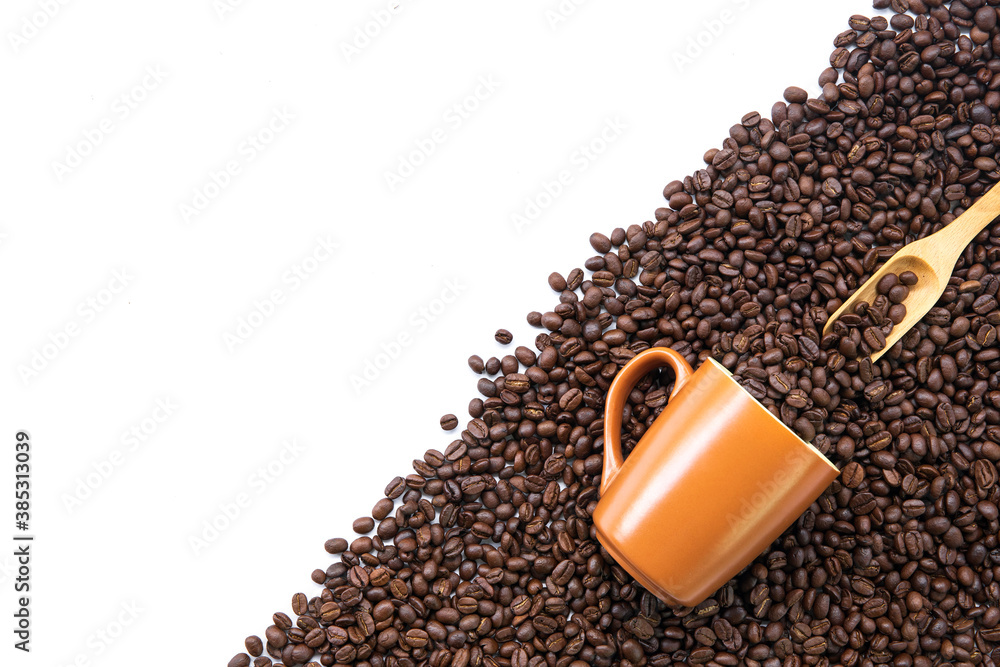 coffee beans in brown glass on white table background. top view. space for text