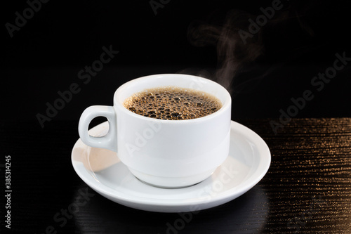 Hot black coffee served in a cup