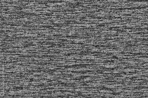 Texture of black and white melange fabric. Cotton casual coarse fabric.
