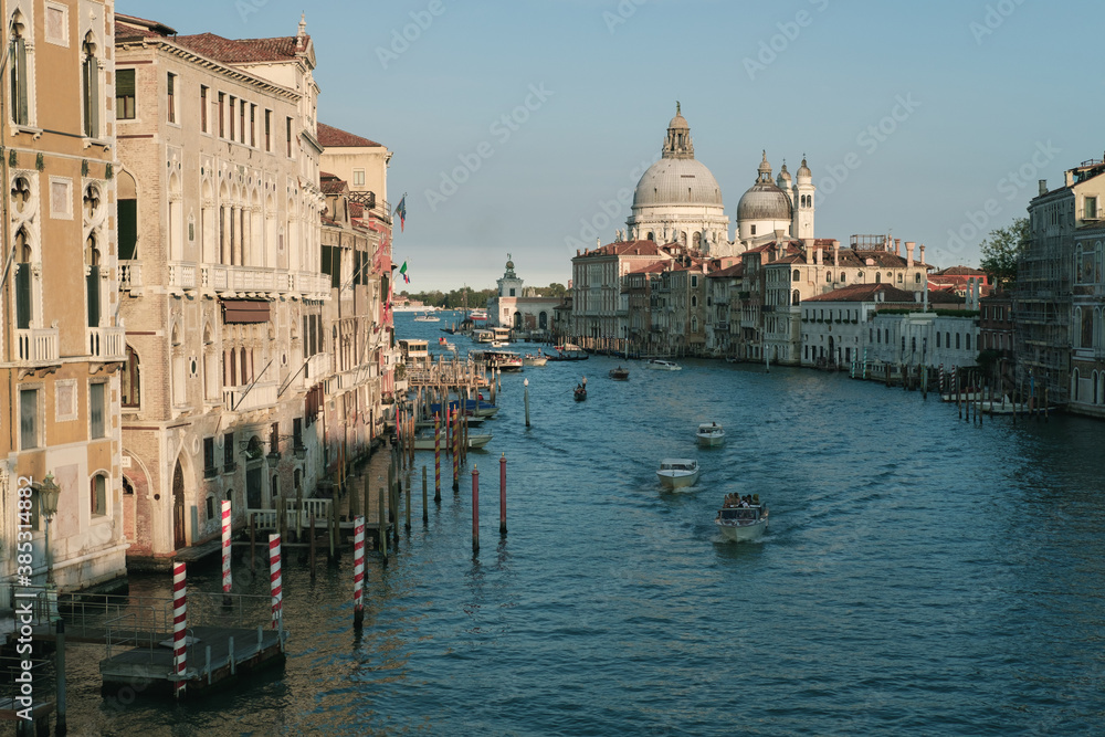 View of Basilica di Santa Maria della Salute and grand canal from Accademia Bridge, Venice, Italy. Golden hour,