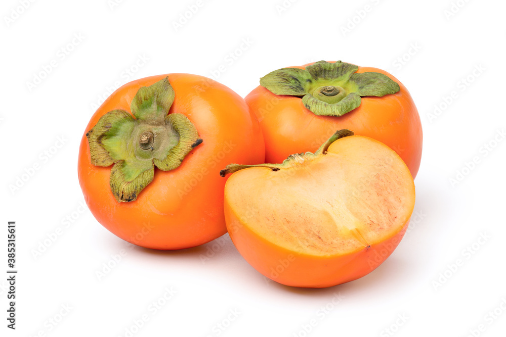 Persimmon fruit with cut in half isolated on white background. clipping path. Persimmon fruit with cut in half isolated on white background. clipping path.